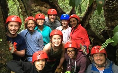 Middle school students take a group photo before they go zip lining in Costa Rica Projects Abroad volunteer prepare for their ziplining experience through the Costa Rican forest